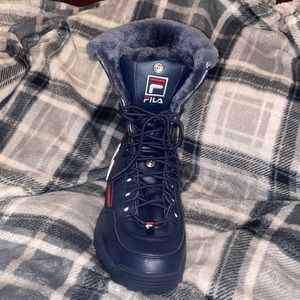 High-top Fila snow boots.